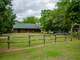 Log Home ON 11 Acres with Pond and Fenced Photo 3